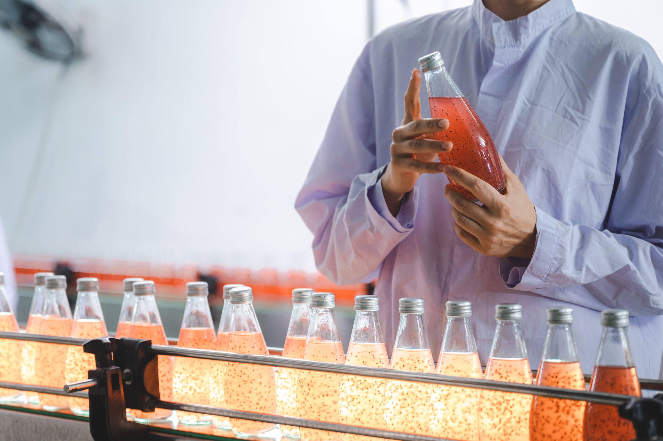 production of beverage bottle with factory manufacture machine, industrial technology working equipment in plant line, food and drink business, modern conveyer automation process, liquid juice